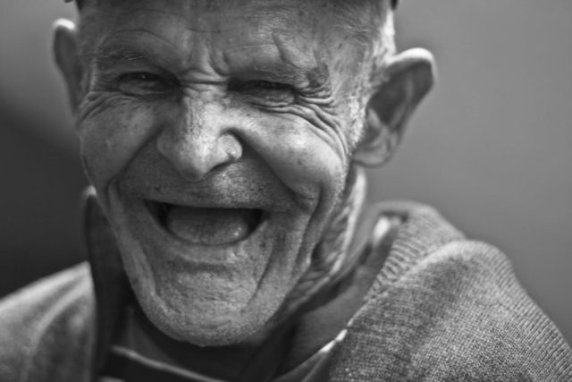 Joyful old man laughing